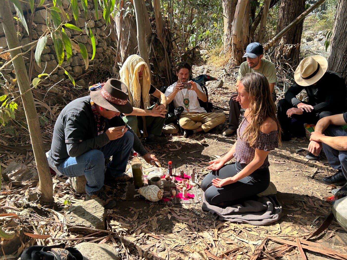 Sacred Ways group gathered around a despacho offering during ceremony in Peru